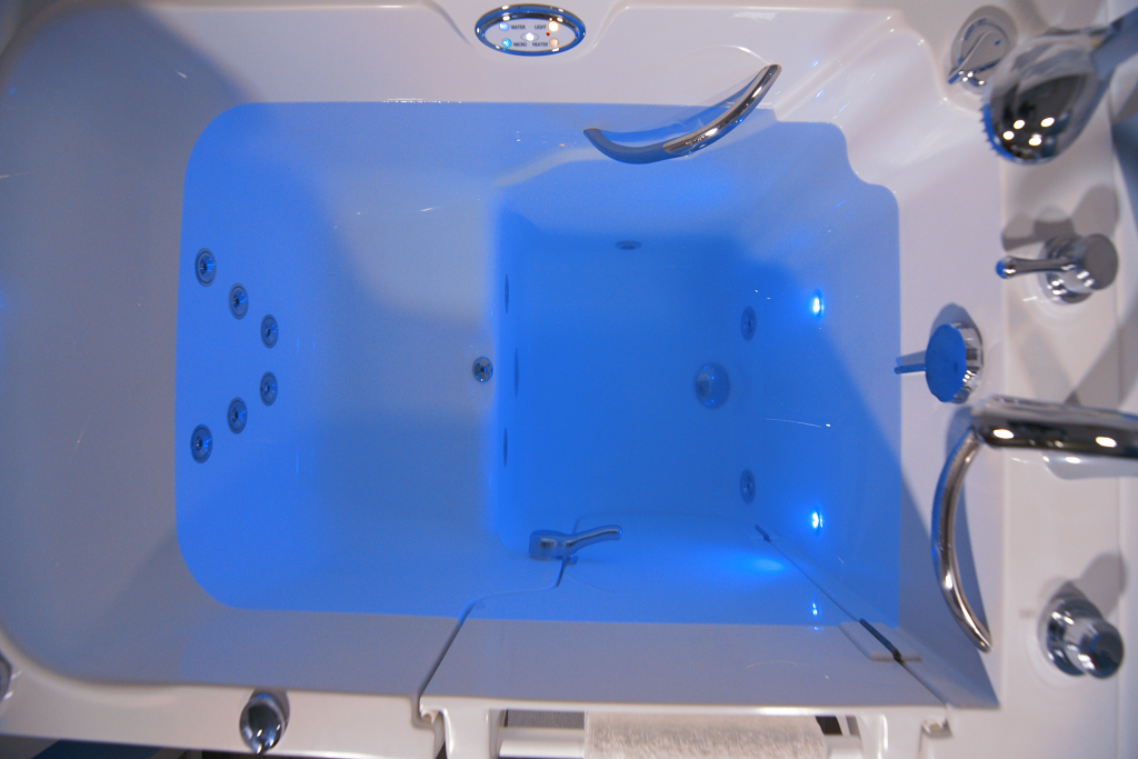 Walk-in tub with UV technology and fall prevention