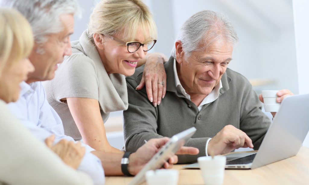 elderly people glisten with joy at the computer after ordering a safe step walk in tub